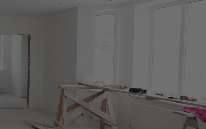 Before remodel — bare walls and subfloor