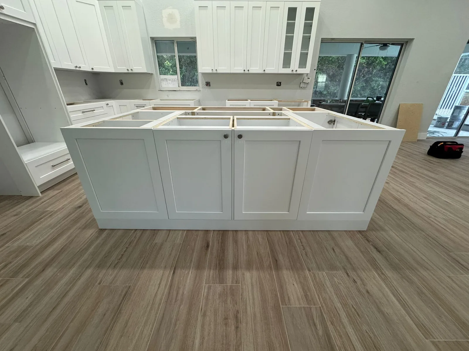 Open-concept white kitchen remodel